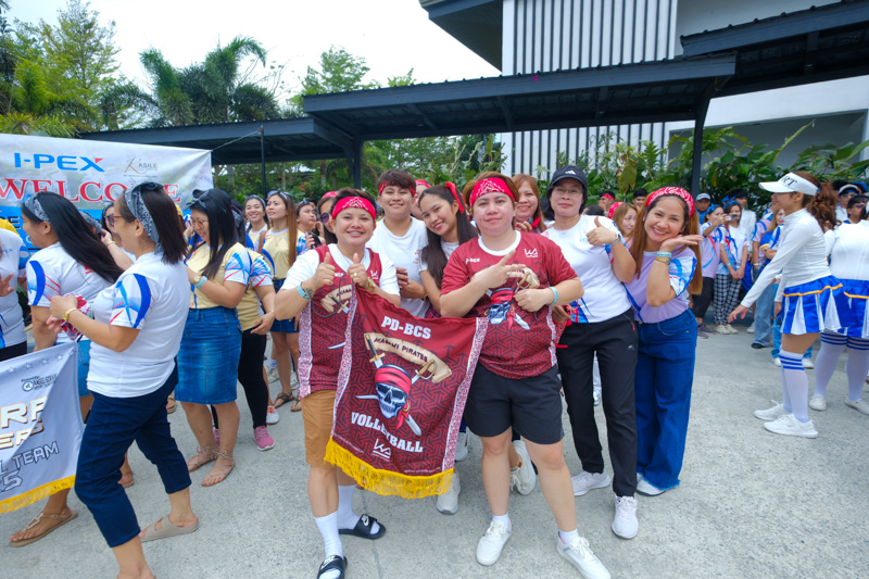 Employees participating in a themed company event indoors