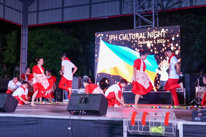 Employees wearing matching event shirts posing together