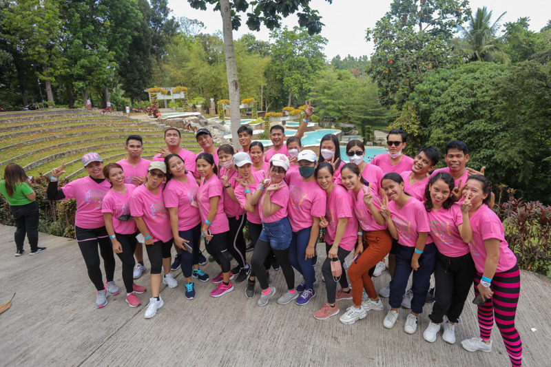 Employees marching together during an outdoor company activity
