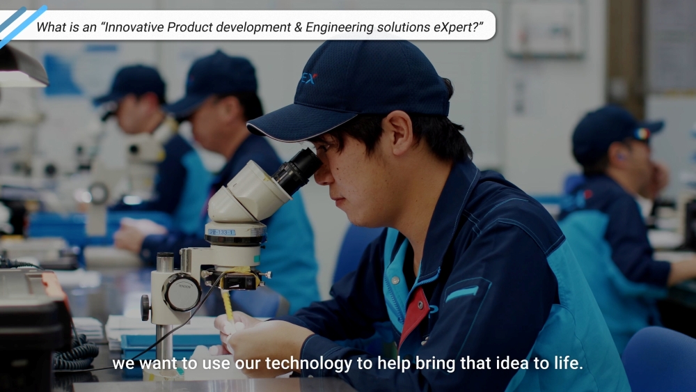Bringing customers' dreams to life—shown alongside an I-PEX employee at work, peering into a microscope.
