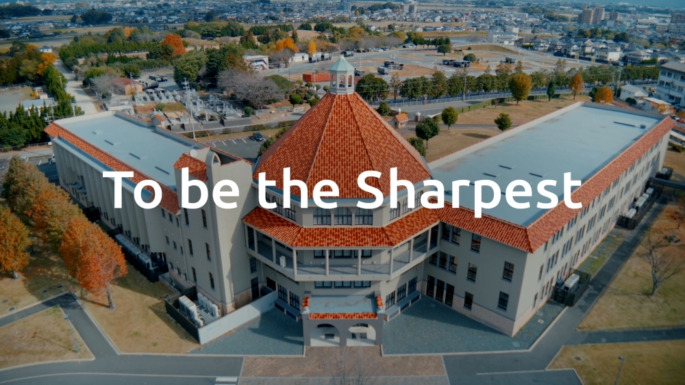 The I-PEX brand tagline 'To be the Sharpest' paired with an aerial view of the I-PEX Campus