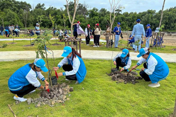 I-PEX Thailand employees planting trees and maintaining green spaces