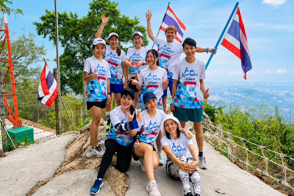 I-PEX Thailand employees participating in an outdoor event with Thai flags