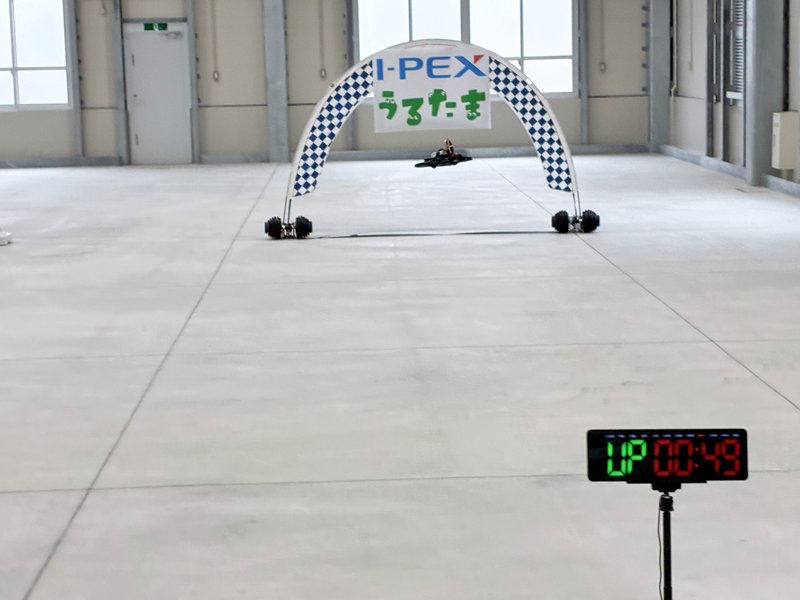 Photo of a drone flying on an indoor course  