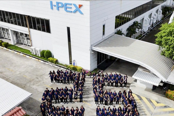 I-PEX Thailand employees forming the number 25 outside the factory to mark the company’s 25th anniversary